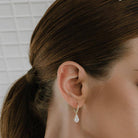 KARP Seraphina Earrings in 18K yellow gold featuring marquise, princess, pear, and round-cut diamonds totaling 1.40 carats.