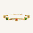 Gold Bracelet with Ruby and Emerald Gemstones by Noura