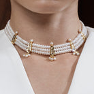 Elegant Modi Pearls Jahanara Set featuring a Chinchpatti choker and matching earrings, showcasing luminous round pearls and gold details.