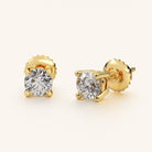 Elegant 14k yellow gold diamond stud earrings featuring brilliant-cut diamonds with a total of .70 carats (each stud .35 carats), showcasing VS clarity and G/H color. Timeless and sophisticated.